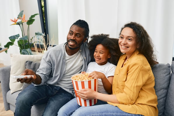 Family streaming tv on the couch