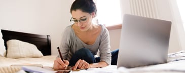woman taking notes