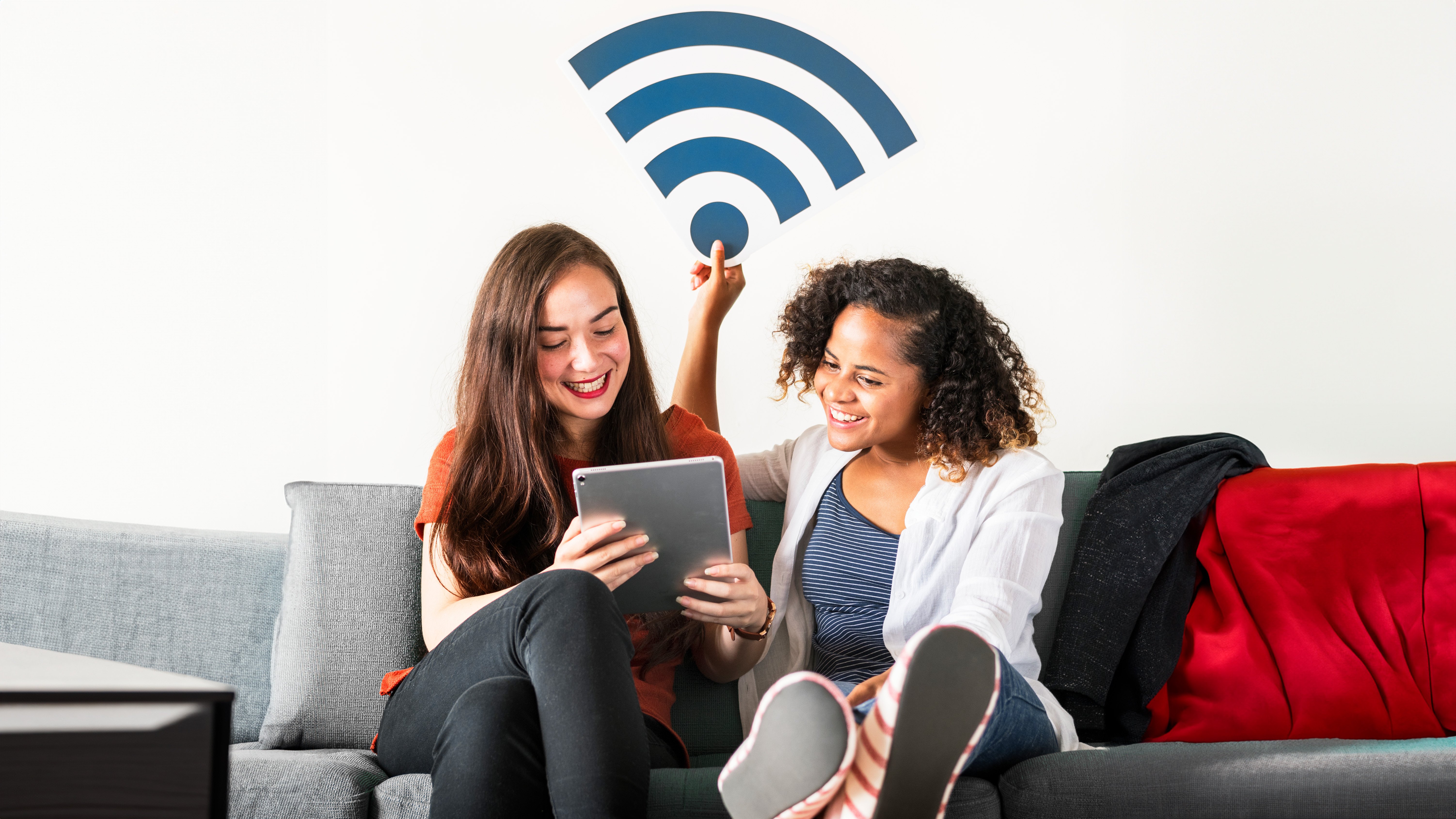 two young ladies sharing wifi